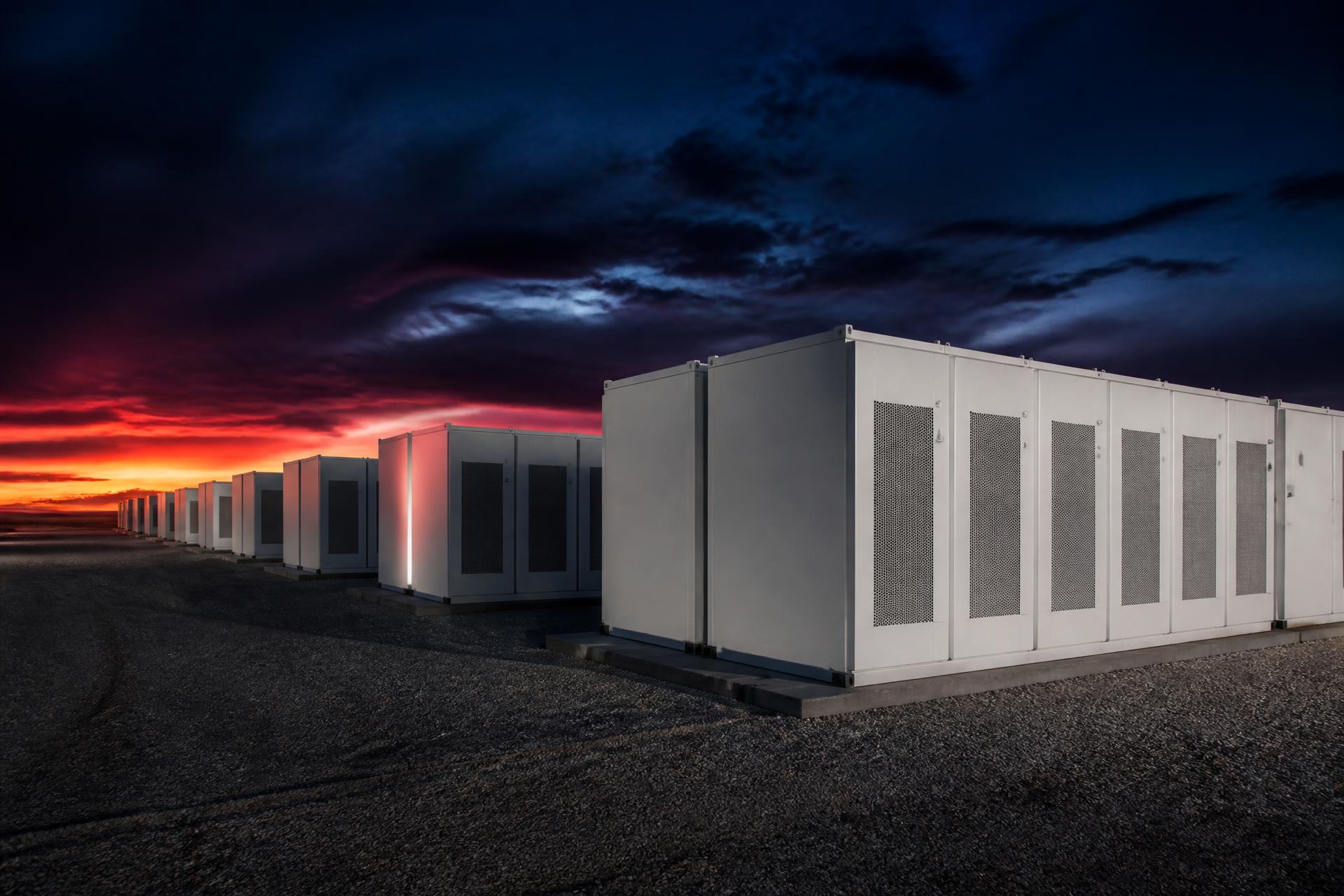 Utility-scale battery energy storage facility at dusk